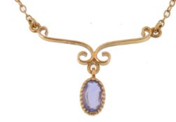 An early 20th Century Edwardian 18ct gold and sapphire pendant necklace. The necklace having a fixed