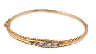 A 19th Century Victorian 15ct gold diamond and sapphire bangle bracelet. The bracelet having a group