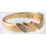 A modern 9ct gold and diamond 9 stone chevron shaped ring. Weight 2.5g