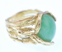 A 1970's French 18ct gold and jade ring. The ring