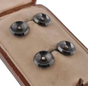 A pair of  Art Deco gold, hematite and diamond cufflinks.  The button style cufflinks formed from