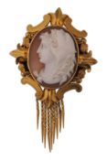 A 19th century French  shell cameo pendant brooch. The brooch having a shell cameo of Alexandra