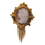 A 19th century French  shell cameo pendant brooch. The brooch having a shell cameo of Alexandra