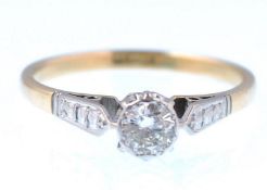 An 18ct gold and platinum single stone solitaire d