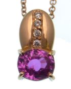 A pink sapphire and diamond pendant, the oval ston