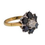 A LADIES 18CT GOLD SAPPHIRE AND DIAMOND CLUSTER RING