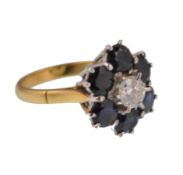 A LADIES 18CT GOLD SAPPHIRE AND DIAMOND CLUSTER RING