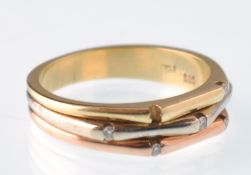 A modern tri-colour 14ct gold gold and diamond 7 stone ring.  The ring being stamped 585, possibly