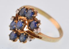 A modern 14ct gold sapphire and diamond cluster ring. Stamped 585 to the shank. Weight 3.8g