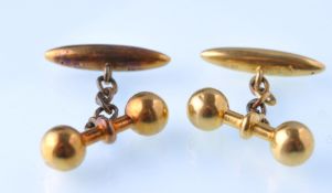 A pair of  late Victorian gold gentleman's cuff links in the form of dumb bells weights ( weight