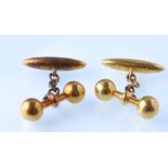 A pair of  late Victorian gold gentleman's cuff links in the form of dumb bells weights ( weight