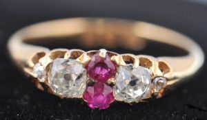 A Victorian hallmarked 18ct gold ruby and diamond ring dated 1893 London. The ring having 2 old