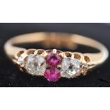 A Victorian hallmarked 18ct gold ruby and diamond ring dated 1893 London. The ring having 2 old