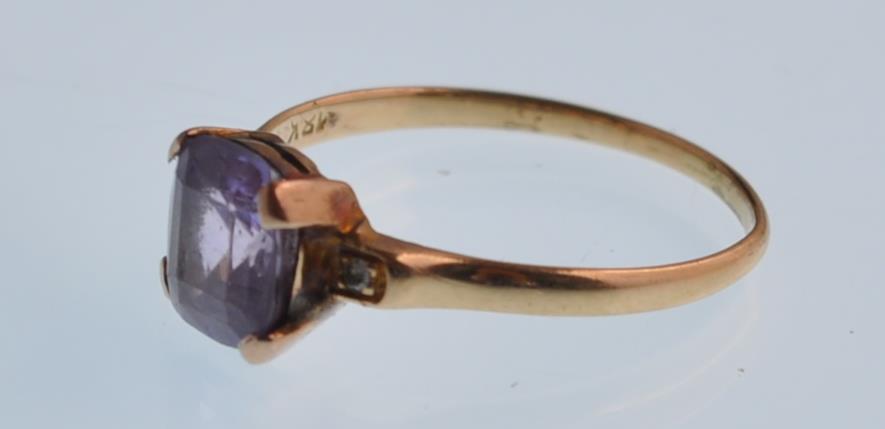 An 18ct gold purple sapphire and diamond dress ring. The violet cushion shaped stone being claw - Image 3 of 4