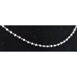 A platinum and pearl chain necklace. The necklace consisting of fine delicate pearl and chain