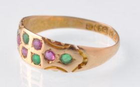 A late Victorian 15ct gold 8 stone emerald and ruby gypsy ring.  Hallmarks for Chester 1895.
