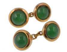 A a pair of gold and chrysoprase cufflinks. The cufflinks formed of two collet set green chrysoprase