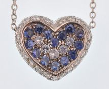 An Italian 18ct white gold, sapphire & diamond heart pendant necklace. The necklace strung with a