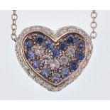 An Italian 18ct white gold, sapphire & diamond heart pendant necklace. The necklace strung with a