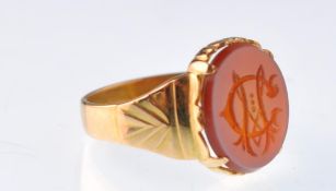 A Victorian gold and sardonyx oval signet ring. Engraved with monogram, apparently unmarked.