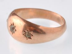 An early 20th century hallmarked 9ct rose gold and colourless paste 3 stone gypsy ring. Weight 1.8g,