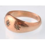 An early 20th century hallmarked 9ct rose gold and colourless paste 3 stone gypsy ring. Weight 1.8g,