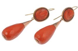 A pair of 19th century gold, cameo coral drop earrings. The earrings having an oval carved cameo