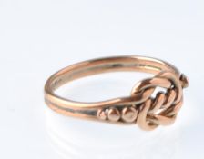 An early 20th century 9ct rose gold knot ring. Marks indistinct, circa 1910 Edwardian. 2.1g