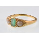 An early 20th century gold emerald and pearl 3 stone ring. 3.7g Weight