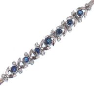 A French white gold sapphire and diamond bracelet. The bracelet set with sapphire and diamond