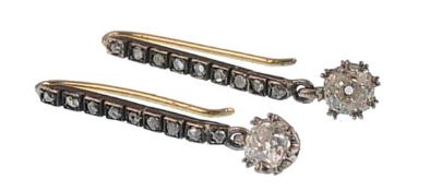 A pair of late 19th century gold and diamond earrings. The earrings consisting of a rose cut diamond