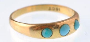 An Edwardian gold and turquoise 3 stone gypsy ring being stamped 18ct. Weight 3.7g