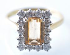 AN 18CT GOLD CITRINE AND DIAMOND LADIES CUSHION CUT RING