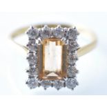 AN 18CT GOLD CITRINE AND DIAMOND LADIES CUSHION CUT RING