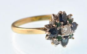 A vintage18ct gold hallmarked London emerald sapphire and diamond cluster ring set in white and
