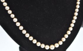 A pearl sapphire and diamond matinee necklace. The necklace consisting of a string of graduated