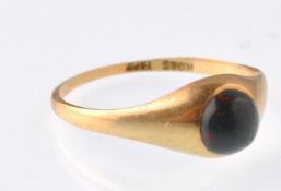 An early 20th century gold  and bloodstone cabochon gypsy ring being stamped 18ct to the inner