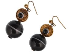 A pair of Victorian banded agate earrings. The earrings having a yellow metal roundel with central