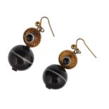 A pair of Victorian banded agate earrings. The earrings having a yellow metal roundel with central