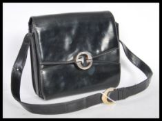 A 20th Century original designer Gucci black leath