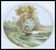 A 20th century hand painted wall charger plate, po