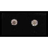 A pair of stamped 14ct white gold stud earrings pr