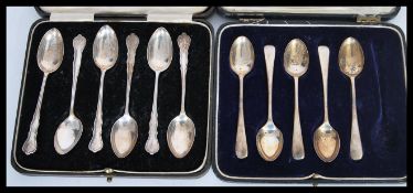 Two sets of cased silver tea spoons to include six