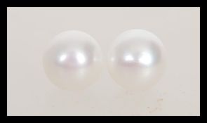 A pair of pearl earrings having 925 silver posts a