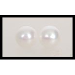 A pair of pearl earrings having 925 silver posts a