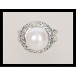 A stamped 925 silver ring set with a large pearl s