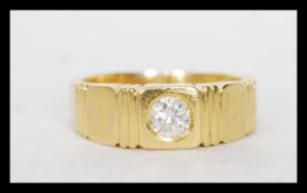 A stamped 18ct gold ring set with a brilliant cut