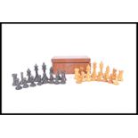 A vintage early 20th Century chess set having boxw