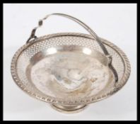 A stamped Sterling silver bon bon dish being raise