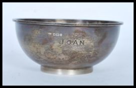 A 20th Century hallmarked silver bowl raised on a